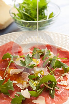 Olive oil over Carpaccio