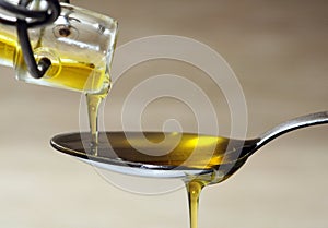 Olive oil over spoon