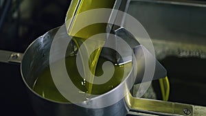 Olive oil production process at food manufactory close up.