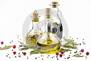 Olive oil, soy sauce, scattered herbs and spices isolated on a white background