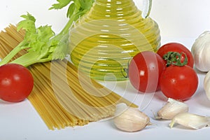 Olive oil, spagetti and vegetables