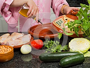 Olive oil in tajine photo