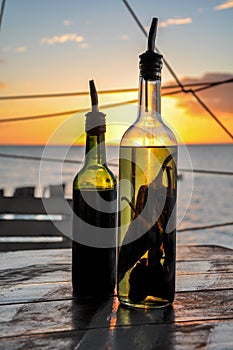 Olive Oil and Vinegar Bottle with Chili Pepper in the Holbox Island Sunset, Mexico