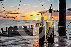 Olive Oil and Vinegar Bottle with Chili Pepper in the Holbox Island Sunset, Mexico