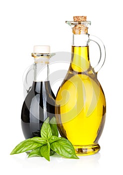 Olive oil and vinegar bottles with basil