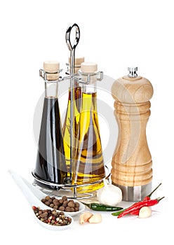 Olive oil, vinegar bottles, pepper shaker and spices