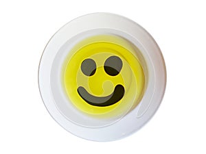 Olive oil and vinegar smily face on a plate isolated on white