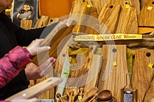 Olive wood cutting boards on the local market in tuscana