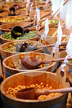 Olives and beans in buckets for sale at market