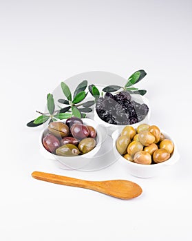 Olives in bowls on white.