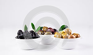 Olives in bowls on white.