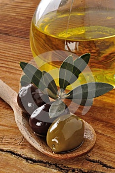 Olives and extra virgin olive oil photo