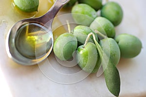 olives fruit and spoon of olive oil