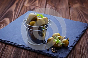 Olives in iron bucket