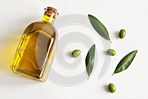 Olives oil bottle with green olive and leave