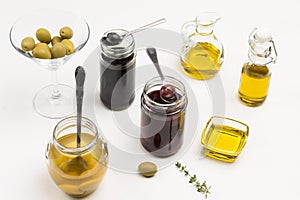 Olives and olive oil in glass jars