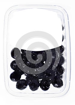 Olives in plastic box surface