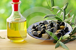 Olives on plate and oliveoil
