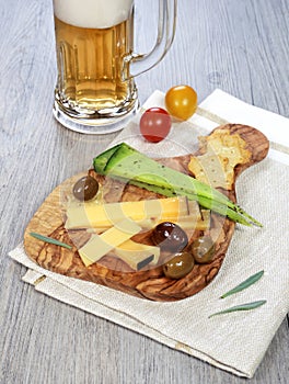 Olives provencal, solid cheeses and a glass of unfiltered beer