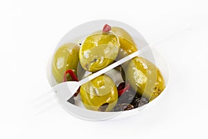 Olives in a small plastic plate photo