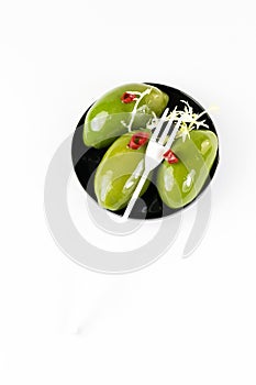 Olives in a small plastic plate photo