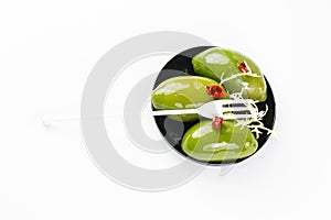 Olives in a small plastic plate photo