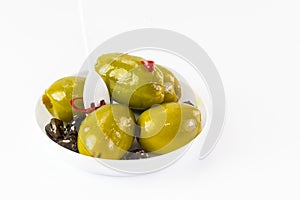Olives in a small plastic plate photo