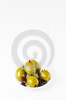 Olives in a small plastic plate photo