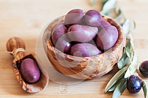 Olives on wooden background, kalamata, kalamon, green olives