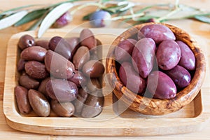 Olives on wooden background, kalamata, kalamon, green olives