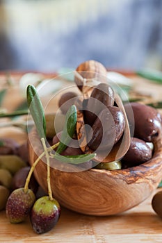 Olives on wooden background, kalamata, kalamon, green olives