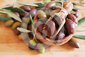 Olives on wooden background, kalamata, kalamon, green olives