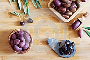 Olives on wooden background, kalamata, kalamon, green olives