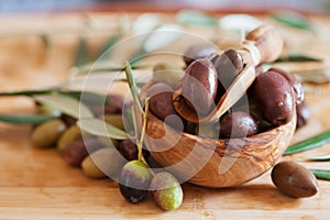 Olives on wooden background, kalamata, kalamon, green olives