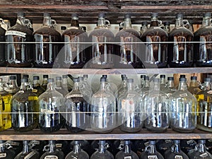 Ollantaytambo, Peru - 2 July, 2022: Bottles of alcoholic beverages in a distillery in the Sacred Valley, Cusco