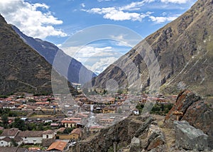 Ollantaytambo ruins, a massive Inca fortress with large stone terraces on a hillside, tourist destination in Peru