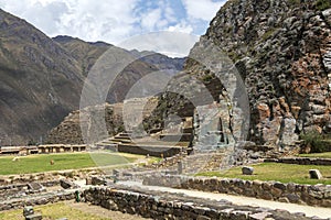 Ollantaytambo ruins, a massive Inca fortress with large stone terraces on a hillside, tourist destination in Peru