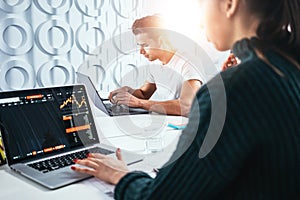 ÃÂ¡olleagues analyze digital reports on screen monitor and preparing financial report for investors photo