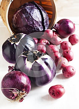 Ð¡ollection of fresh purple toned vegetables.