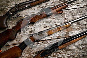 ollection of hunting rifles