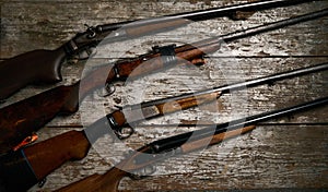 ollection of hunting rifles