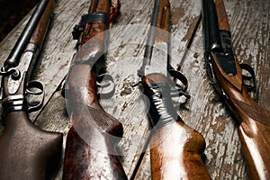 ollection of hunting rifles