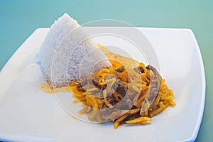 OLLUCO dish with roast beef onion and rice food photo