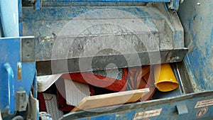 OLOMOUC, CZECH REPUBLIC, FEBRUARY 24, 2021: Waste crushing rubbish collection detail large truck machine mattress wood