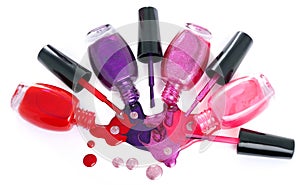 Ð¡olored nail polish splash, spilling from bottles