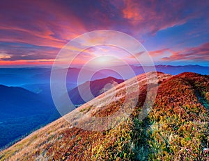 Ð¡olorful autumn sunrise in mountains.