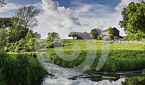 Ols Red Barns on a Lush Green Hilltop in the Hudson Valley photo