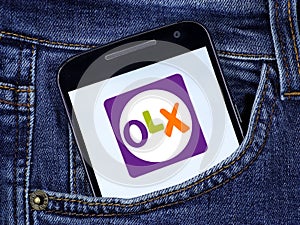 OLX app on smartphone screen on white background