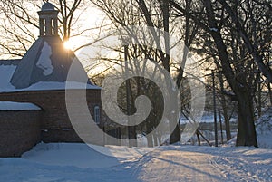 Olyka fortress tower in rays of setting sun