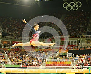 Olympic champion Aly Raisman of United States competes on the balance beam at women's team all-around gymnastics